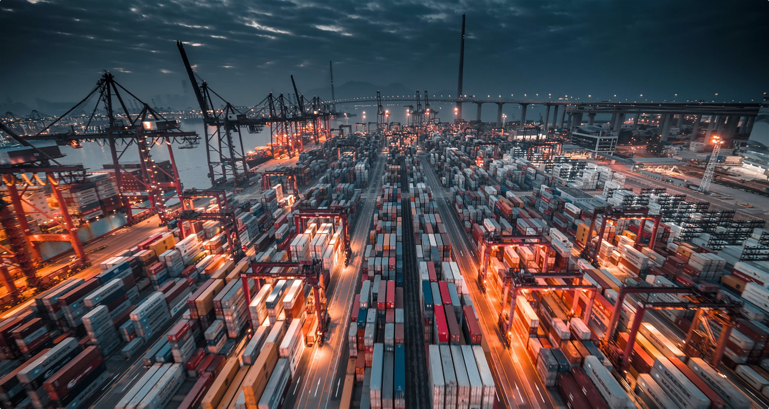 overview of shipping containers at a port at night